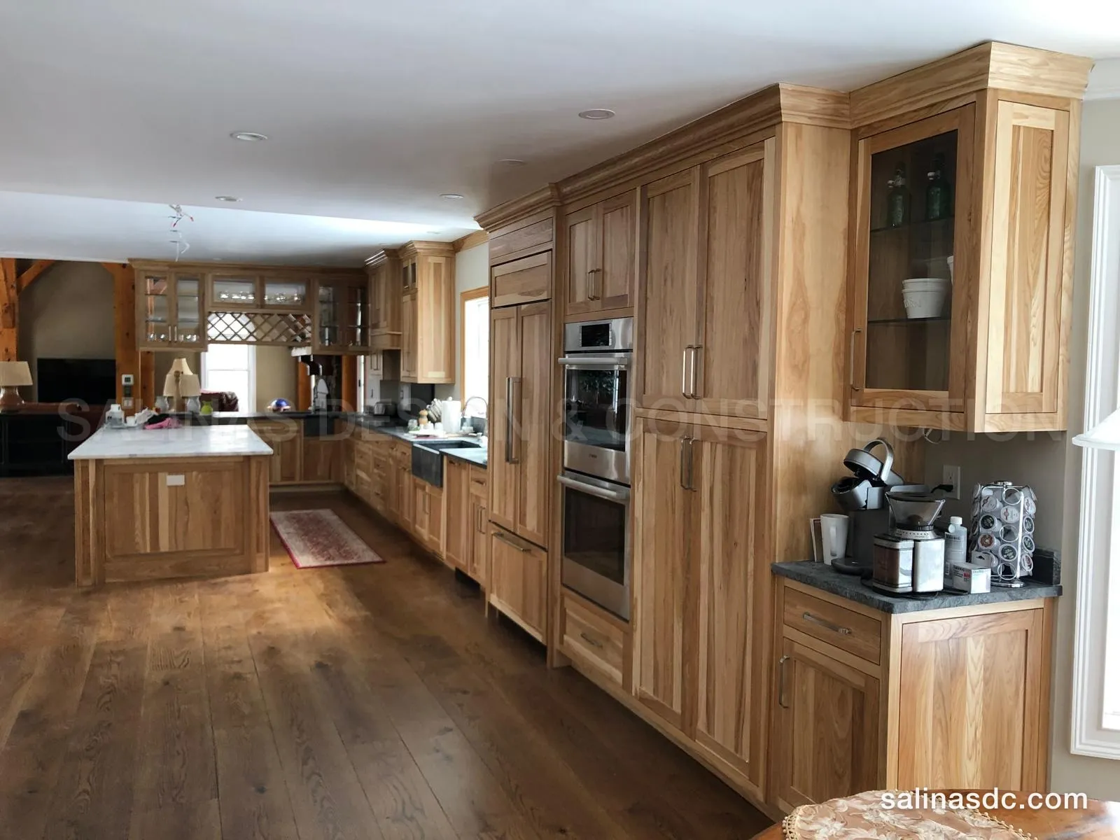Custom hickory kitchen cabinetry in Southbury, Connecticut: full height cabinets, double wall ovens and an island
